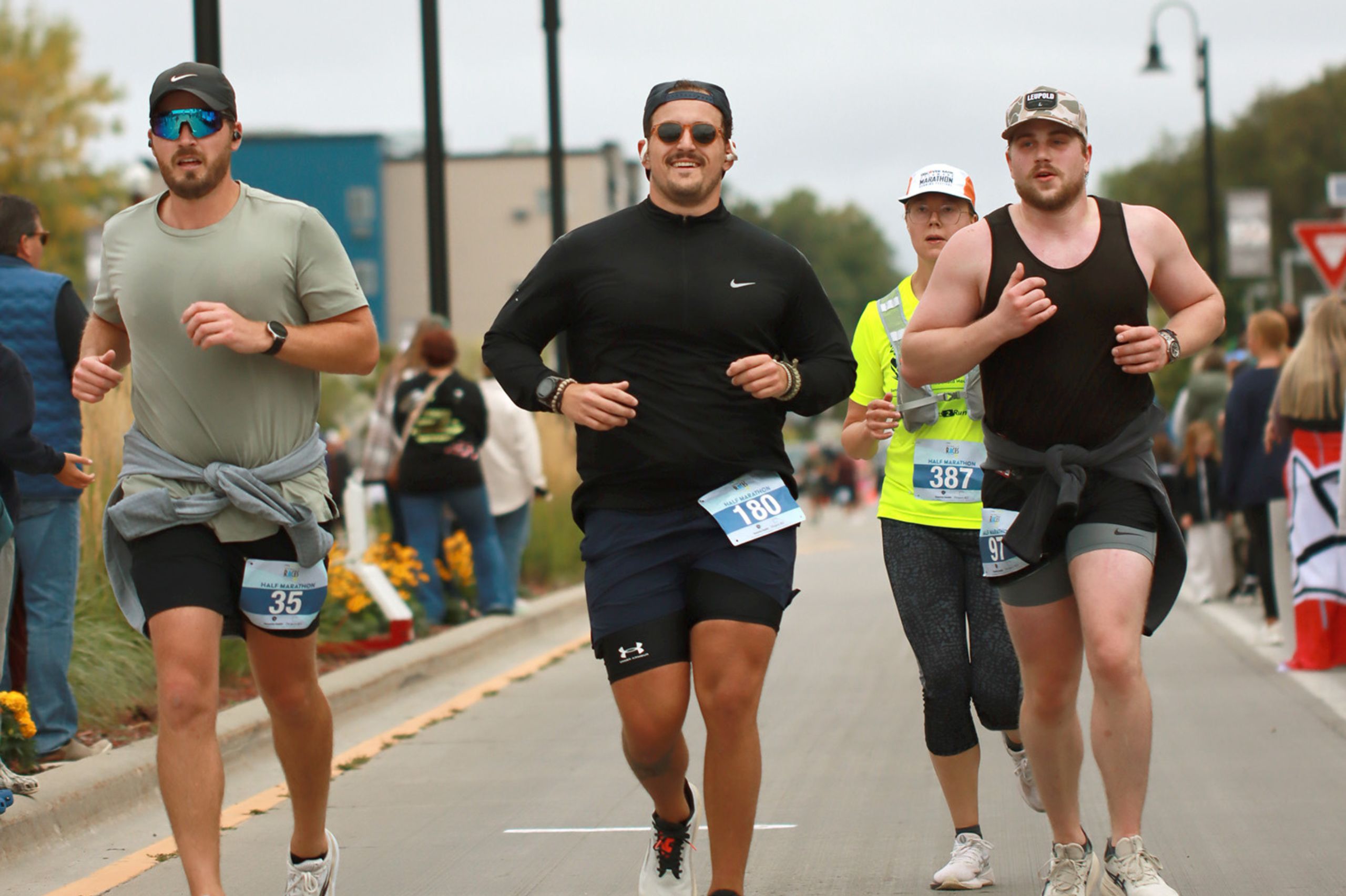 Three males running