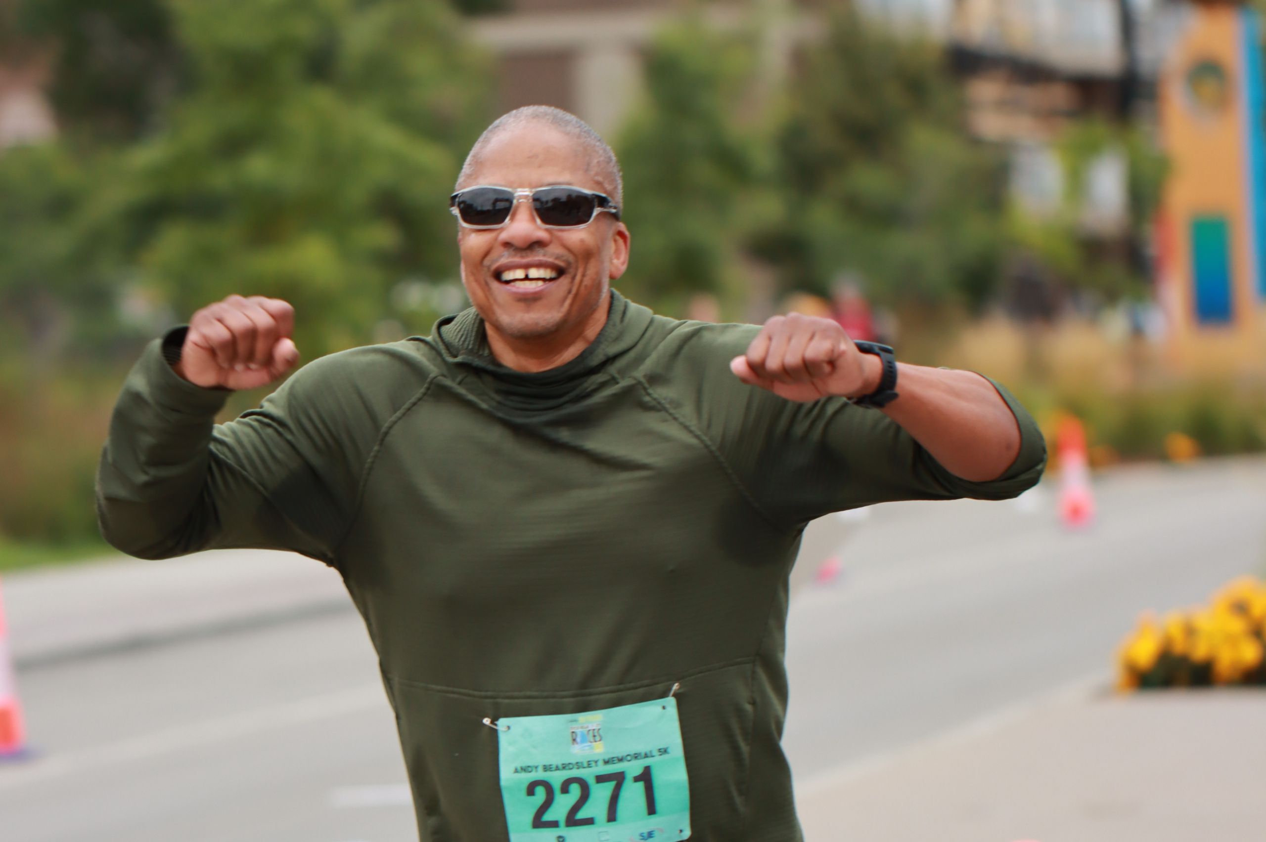  a happy man celebrating while running